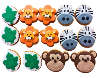 Set di biscotti decorati a tema jungla per feste di compleanno bambini, realizzati artigianalmente da Berry Cakes Siracusa. Biscotti a forma di animali della giungla: leoni, zebre, scimmie e foglie, perfetti per party a tema e decorazioni originali.